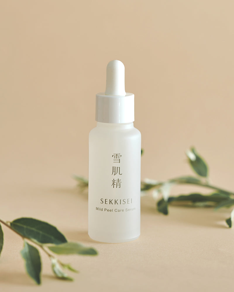 Sekkisei Clear Wellness Mild Peel Care Serum with greenery around the product. 